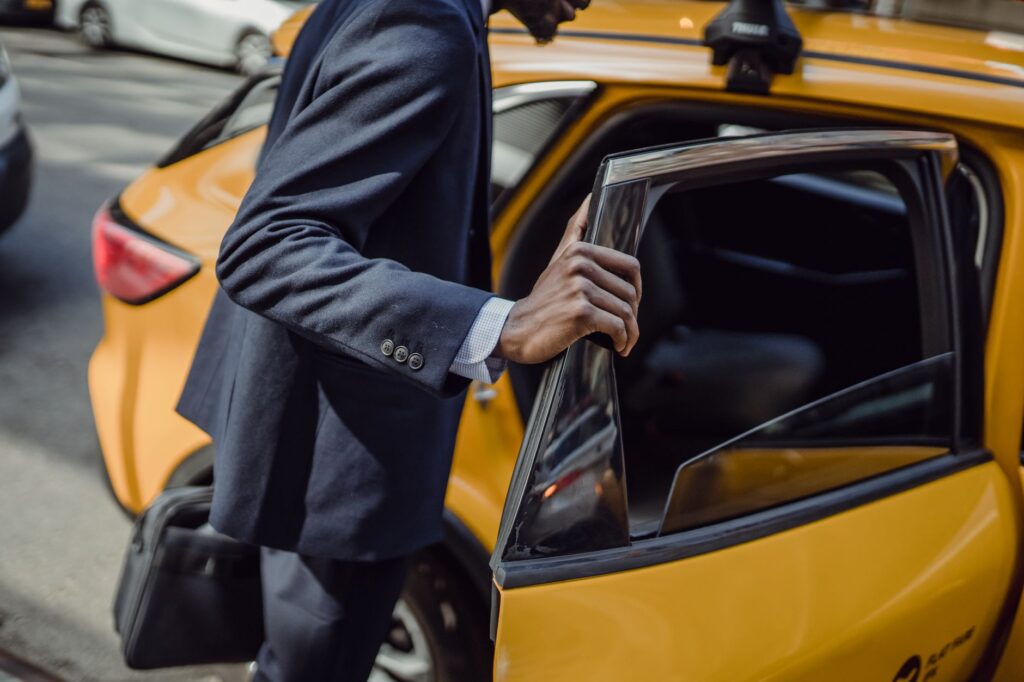Bodyguard services in dubai bodyguard opening car door, Bodyguard Services Dubai