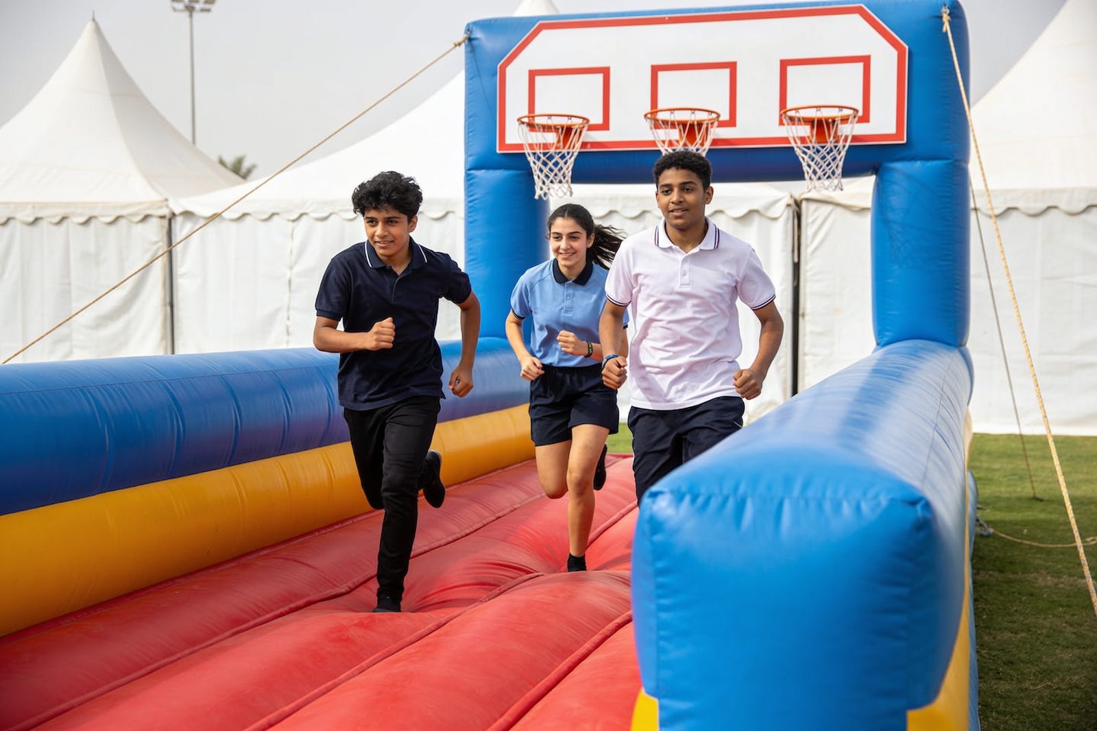 Teens playing bungee run at a school event in Dubai