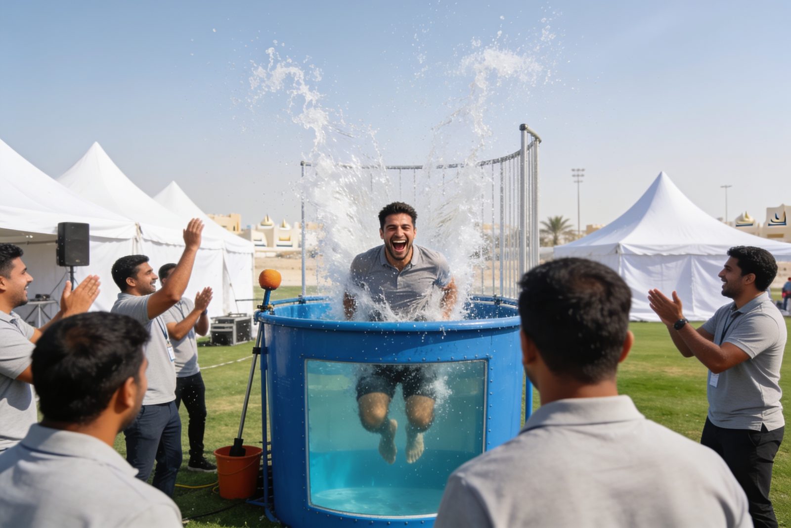Splash from a dunk tank at a corporate family day in Dubai