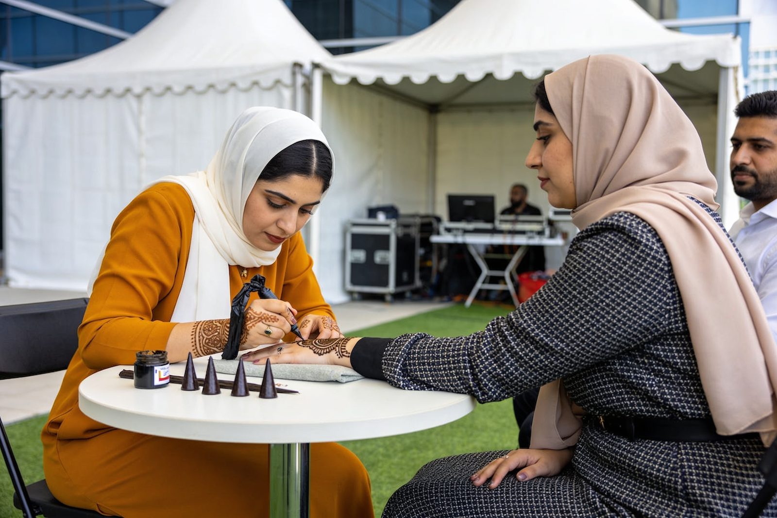 Henna artist at a corporate National Day event in Dubai